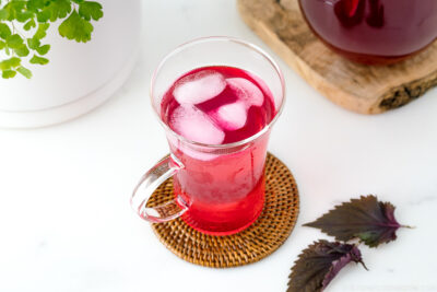 A glass containing Aka Shiso Juice.