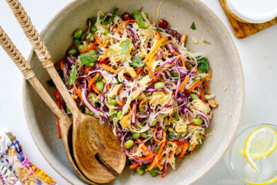 A large salad bowl containing Asian Cabbage Salad.