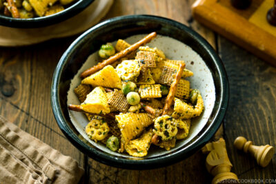 A ceramic bowl containing homemade Furikake Chex Mix.