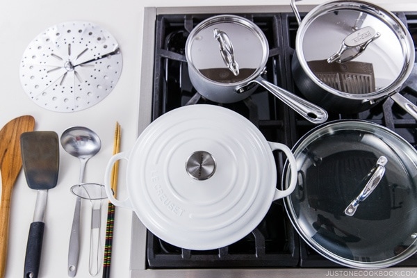 Various pots and pans on the stove.