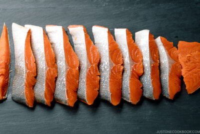 Step by step instructions on how to cut half a salmon into thin Japanese-style fillets.