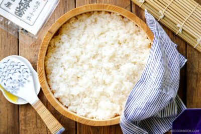 Sushi oke (Hangiri) containing sushi rice made with cooked Japanese short-grain rice, rice vinegar, sugar, and salt.