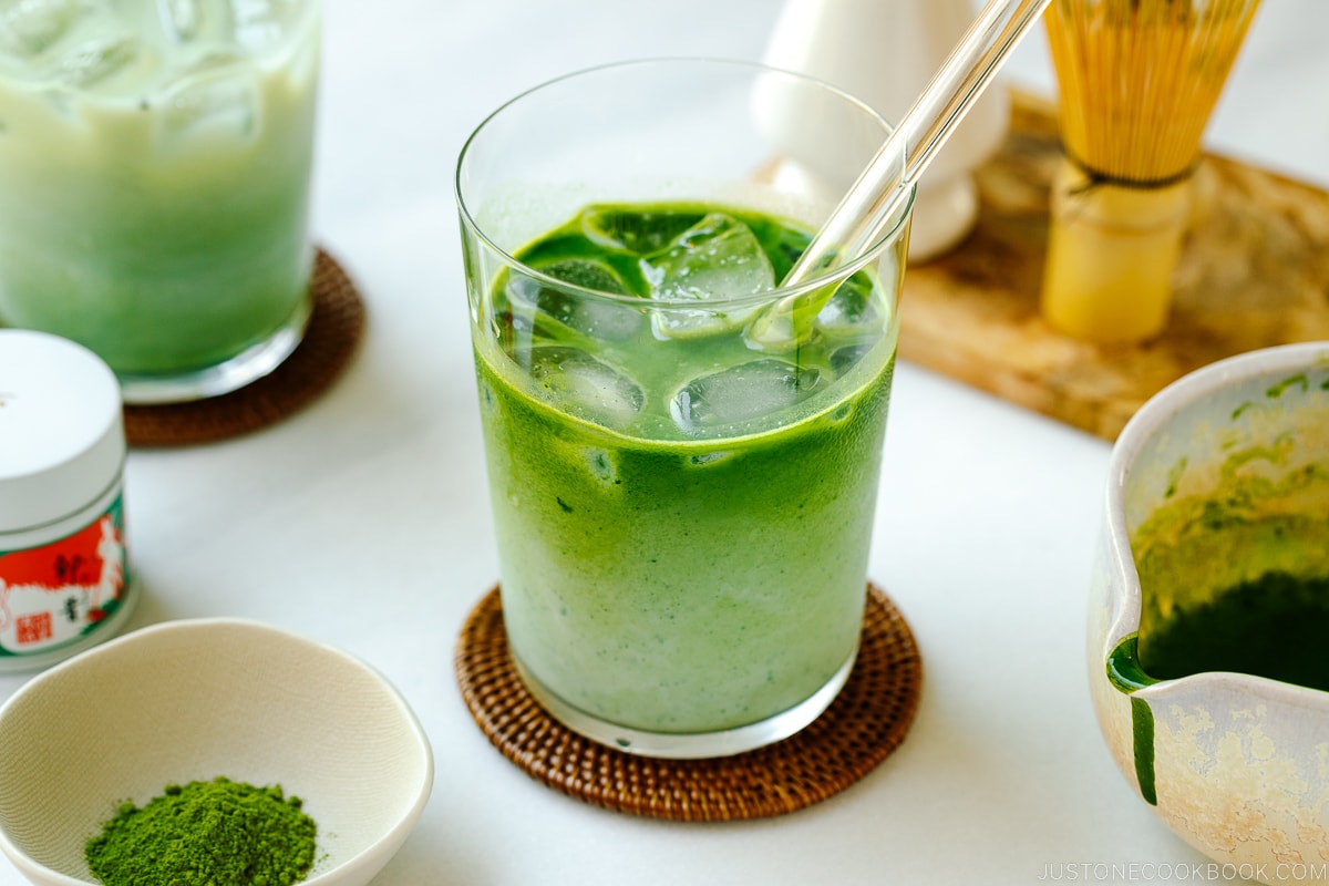 Tall glass cups containing Iced Matcha Latte.