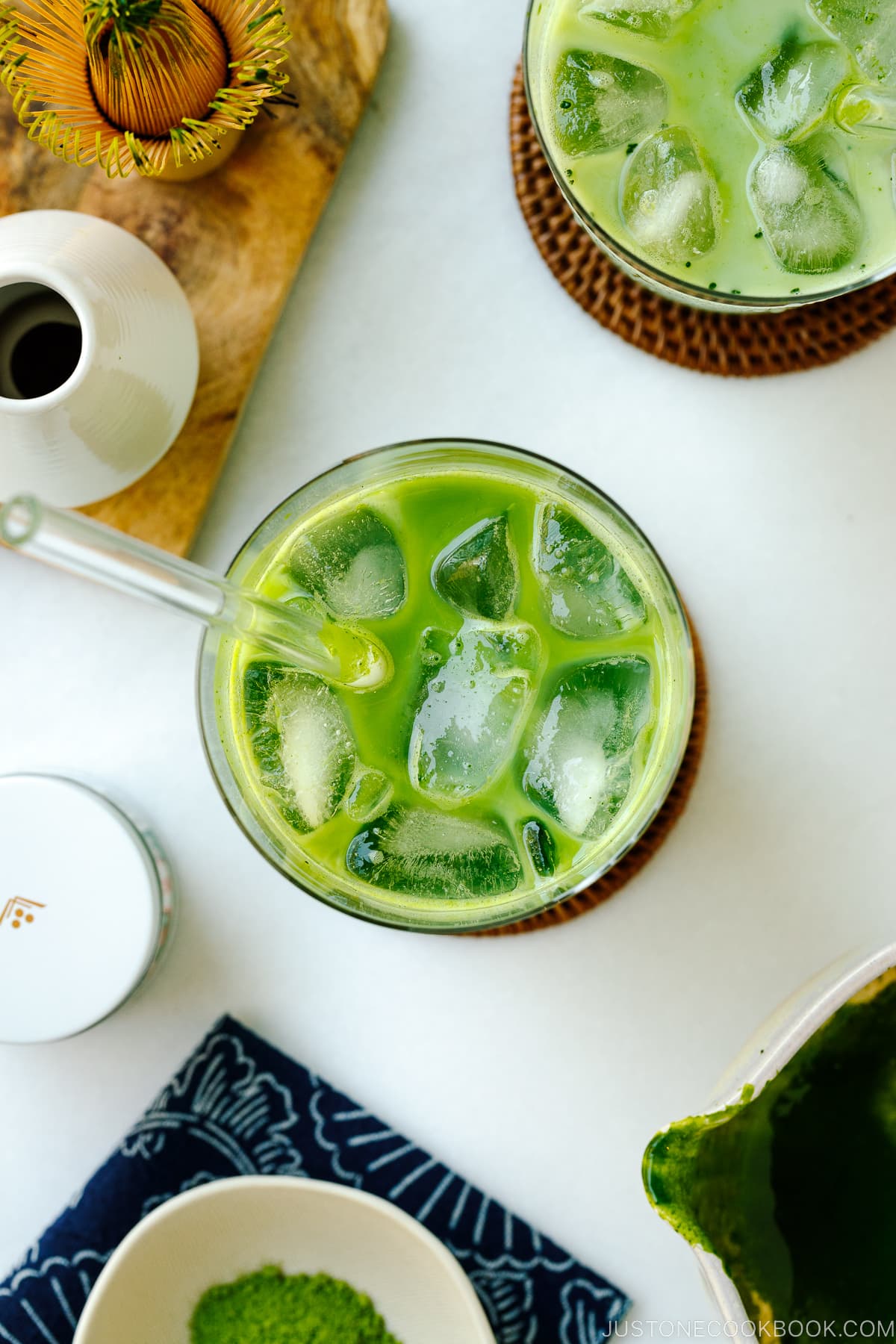 Tall glass cups containing Iced Matcha Latte.