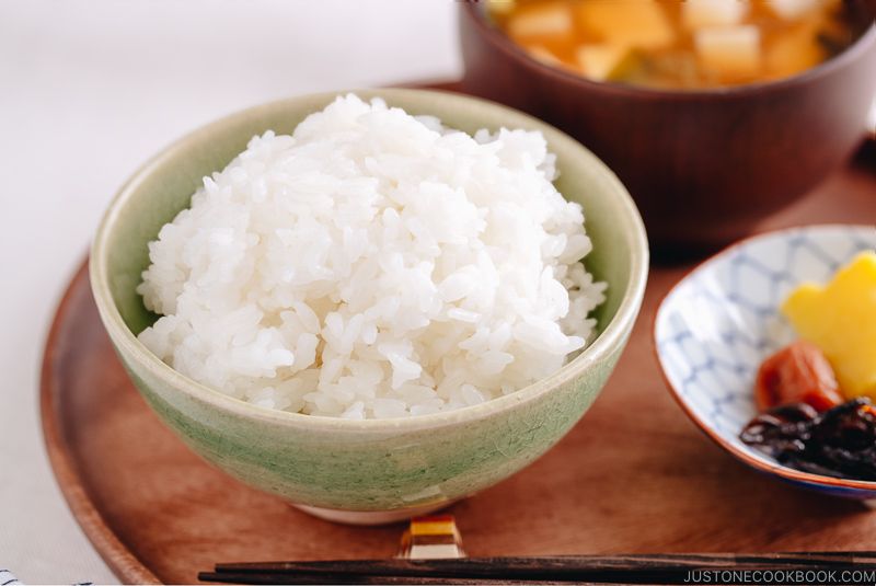 Perfectly cooked rice served in a rice bowl along with miso soup.