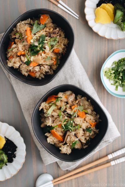 Black ceramic bowls containing Japanese Mixed Rice (Takikomi Gohan).