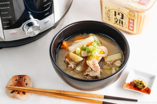 Tonjiru served in a black bowl.