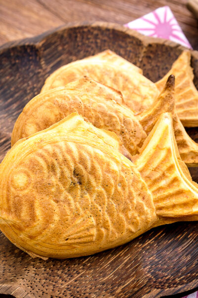 Taiyaki served on a wooden plate.