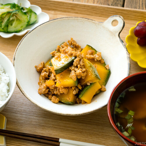 A white ceramic containing Kabocha Pork Stir Fry.