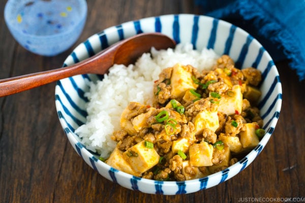 A Japanese blue and white bowl containing Mapo Tofu over steamed rice.