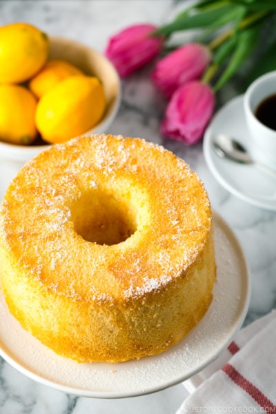 Meyer Lemon Chiffon Cake on a white cake stand.