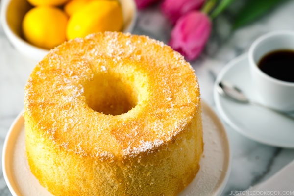 Meyer Lemon Chiffon Cake on a white cake stand.