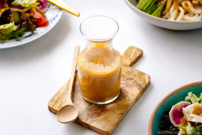 A glass jar containing homemade Miso Dressing.