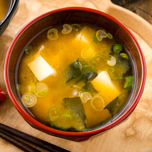 Japanese miso soup bowls containing tofu and wakame miso soup.