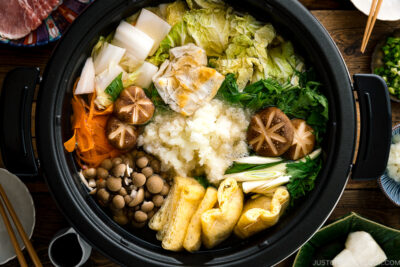 An electric hot pot containing Mizore Nabe, a Japanese hot pot with grated daikon.