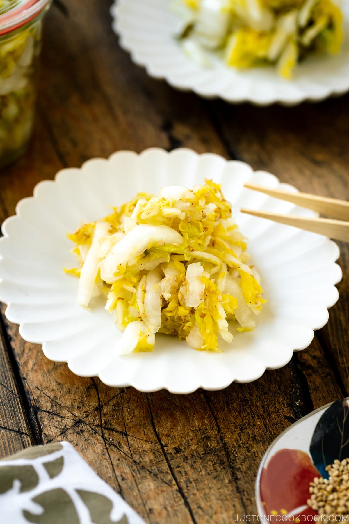 A white ceramic plate containing Napa Cabbage Pickles (Tsukemono).