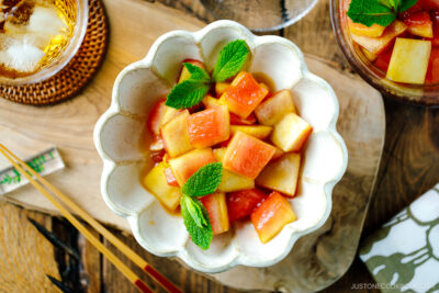 A fluted bowl containing Pickled Watermelon Rind.