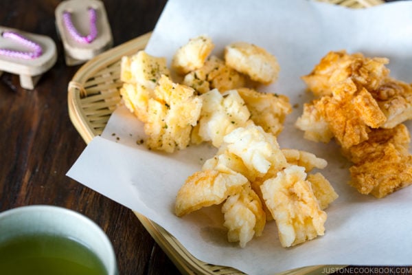 Rice crackers served on a bamboo basket.