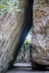 a walkway wedged between two large stones at Seifa-utaki 斎場御嶽 - Okinawa Travel Guide | justonecookbook.com