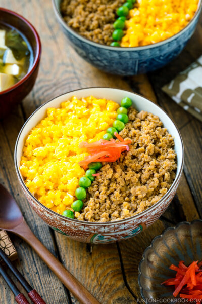 A bowl containing Soboro Don (seasoned ground chicken and scrambled egg over rice).