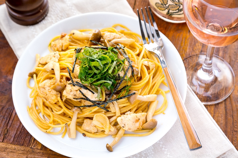 A white plate containing ume shiso pasta.