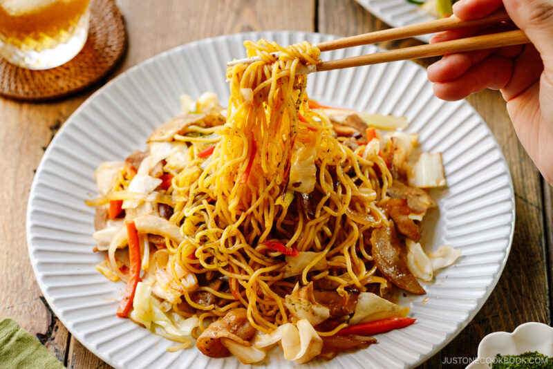 A fluted plate containing Yakisoba (Japanese Stir-Fried Noodles).